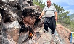 Yıllardır yanmaya devam eden Amanos Dağı eteğindeki taş, ilgi çekiyor